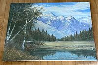 Full view of the oil painting showing the entire mountain and tree landscape on canvas