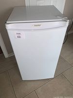 Front view of white Danby compact refrigerator model DCR038W with closed door and visible logo.