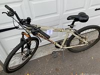 Full side view of the men's DiamondBack Outlook mountain bike showing frame, tires and handlebars.