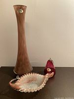 Photo showing all three items: the tall vase, cranberry apple, and ruffled dish together.