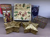 All decorative Christmas boxes and the unused notepad shown grouped on a tabletop.