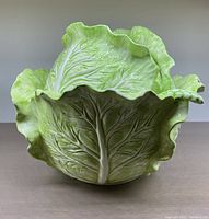 Front view of cabbage leaf shaped soup tureen bowl showing detailed veins and ruffled edges