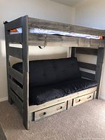 Overall assembled bunk bed with futon lower and two storage drawers