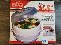 Box of Handy Gourmet 2-tier Microwave Steamer, showing product image, brand, and features.