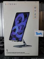 Front view of the Satechi aluminum desktop stand packaging showing iPad mounted on stand and brand name