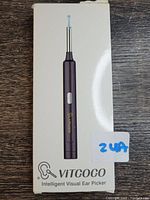 Front of box showing the Vitcoco Intelligent Visual Ear Picker and branding.