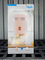 Front photo of boxed wireless juicer blender cup with image of the product, showing blue color option selected on box.
