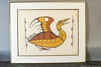 Frontal view of the framed print showing the bird artwork and visible damage to the glass in bottom left corner.