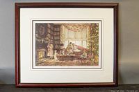 Framed print showing a cozy Christmas morning scene with children and an adult near a Christmas tree and fireplace.