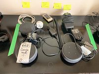 All items in the lot including Google Nest Mini, Amazon Echo Dot speakers, Apple iPod, and Motorola Star Tac phone with accessories