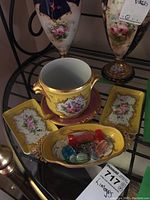 Photo showing full set of Limoges porcelain pieces including vases, pot, trays, and oval dish with glass candies