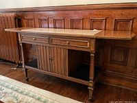 Front angled view showing marble top, drawers, central cabinet and open side compartments