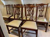 All six chairs arranged in two rows against wall