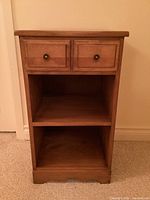 Front view of entire bedside table showing two drawers over two shelves