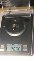 Image of gemstones weighed on digital scale showing total weight 2.86 carats.