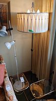 Overview of two side tables and two floor lamps in room