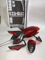 Bio-Bug remote control toy, remote, and instruction manual shown on flat surface.