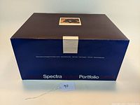 Outer packaging box of Polaroid Spectra System Portfolio Gift Set showing minimal wear and labels