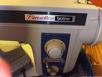 Close-up image of the Brother Pacesetter XL731 sewing machine showing the brand label and stitch length control dial.