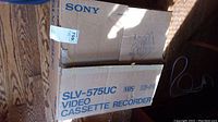 Sony SLV-575UC video cassette recorder box showing model number and VHS format labeling.