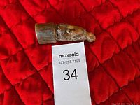 Image showing the detailed carving and horn material of the vintage Chinese buffalo horn sculpture, with a MaxSold inventory tag.