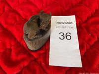 Close-up of the vintage buffalo horn sculpture showing the resting buffalo and base