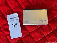 Front view of closed Sony SRS-10 stereo active speaker system showing model and stereo markings.