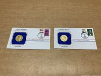 Two commemorative envelopes featuring George Washington and Abraham Lincoln, each with gold-tone coin and postage stamp.