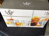 Box showing Mayfair & Jackson branding and image of various drinking glasses filled with beverages.
