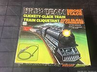 Full box front showing product name, image of train, and illustration of track layout