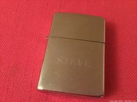 Front view of silver-tone Zippo lighter engraved with the name 'Steve'