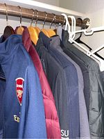 Blue Nike Arsenal jacket prominently showing logo and sleeve detail.