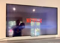Photo of the TV powered on with Netflix screen visible