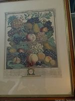 Framed vintage print depicting various fruits illustrating October from Robert Furber's 1732 Fruit of the Month series, showing fruit detail and partial frame.