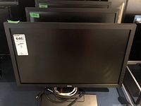 Front view of one BenQ monitor GL2450-B with black bezel and coiled power cable at base