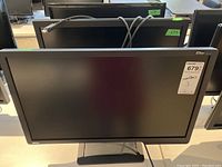 Front view of one 24-inch BenQ monitor showing screen and stand