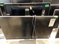 Front view of monitor showing screen, bezel, and power cable.