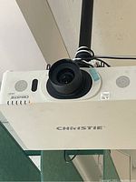 Underside view showing lens and ceiling mount