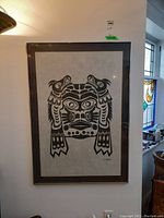 Framed print hanging on a wall, showing the entire artwork and frame.