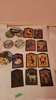 Overview of 13 farm animal and pub-themed wall plaques arranged side by side