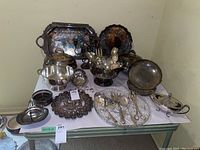 Overview of full lot with trays, bowls, utensils and candelabra