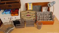 Overall view of pens, mail holders, and lamp arranged on table
