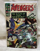 Front view of The Avengers Issue 32 comic book cover showing multiple Avengers characters and title text.