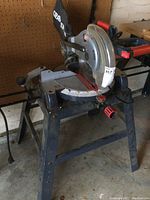 Full side view of Craftsman chop saw mounted on metal stand showing overall condition and setup.