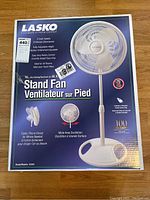 Box of Lasko 16-inch stand fan model 2520C showing product features and brand details.
