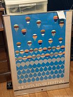 Full view of the framed Wichita River Festival 1984 poster showing the colorful hot air balloons and water drop design.