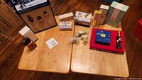 Full table view showing assortment of perfumes, soaps, and body oil.