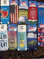 Top view of 10 new ultra slim can and bottle holders with varied designs
