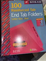 Box of Smead 100 reinforced tab end tab folders in red, letter size, showing branding and product details.