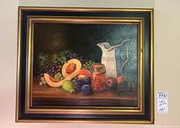 Full frontal view of framed still life painting.